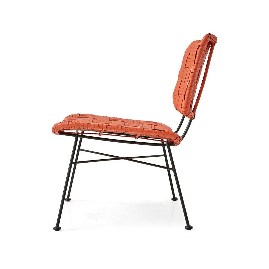 side profile of orange rattan lounge chair by HKLIVING with open woven back