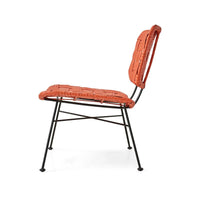 side profile of orange rattan lounge chair by HKLIVING with open woven back