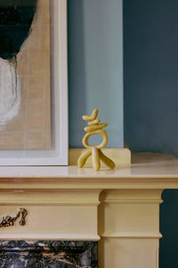 HKLIVING sculptural resin ornament on mantelpiece beside framed artwork
