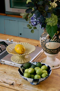 large HKLIVING ribble bowl in beige used as statement fruit bowl on kitchen island
