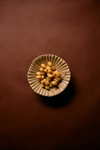 mokka beige pedestal ribble bowl by HKLIVING photographed from above with fruit for centrepiece inspiration
