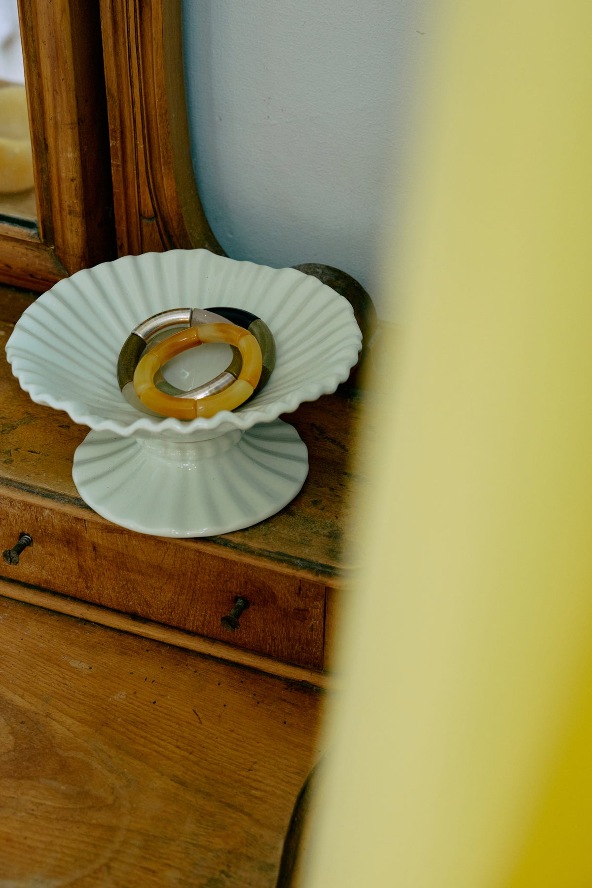 hkliving ribble bowl in ice blue used as a jewellery display bowl on wooden dresser
