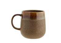 brown stoneware mug with glossy rim and reactive glaze finish
