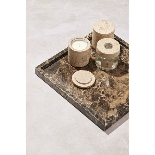 Dark brown Isabella marble tray styled with candles in cream and glass holders