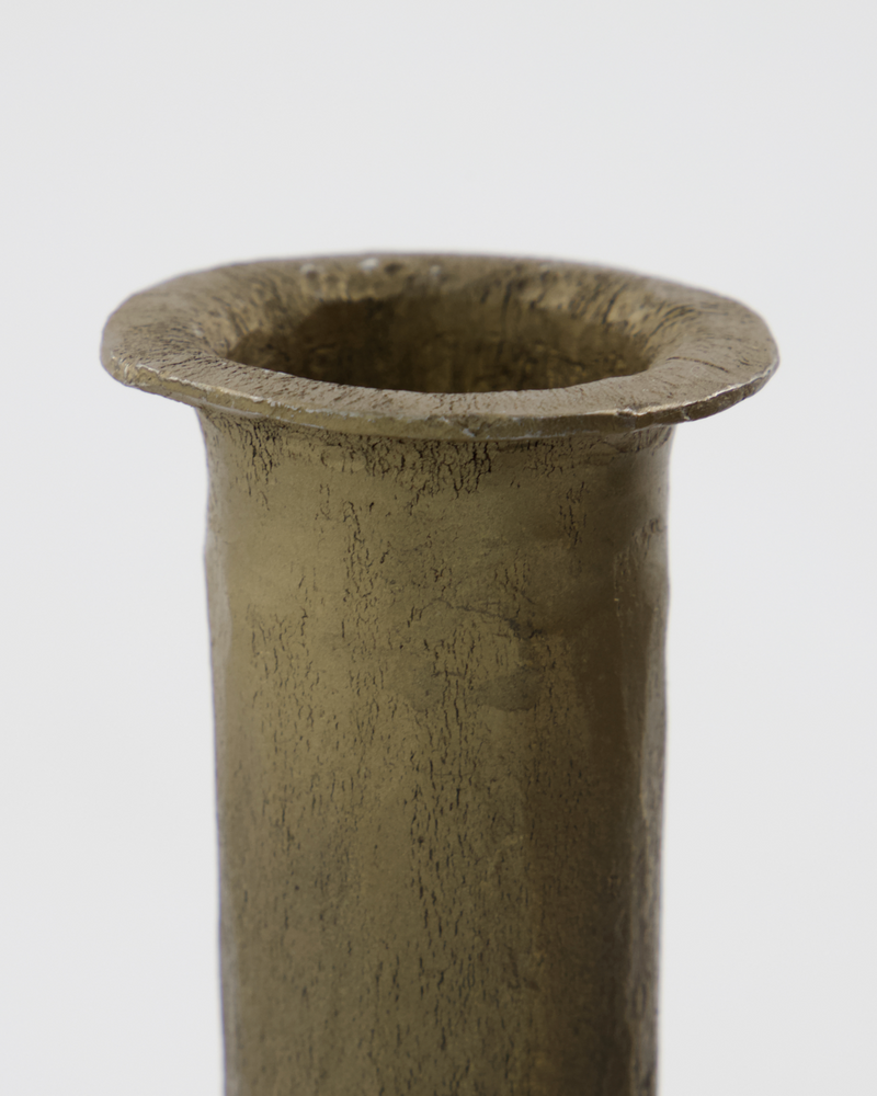 close-up of textured antique gold candle holder showing handcrafted uneven rim