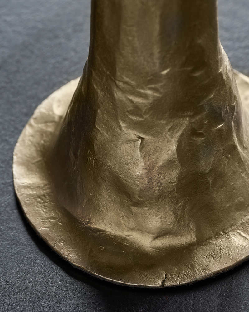 close-up of flared base with textured antique gold finish on House Doctor candle holder