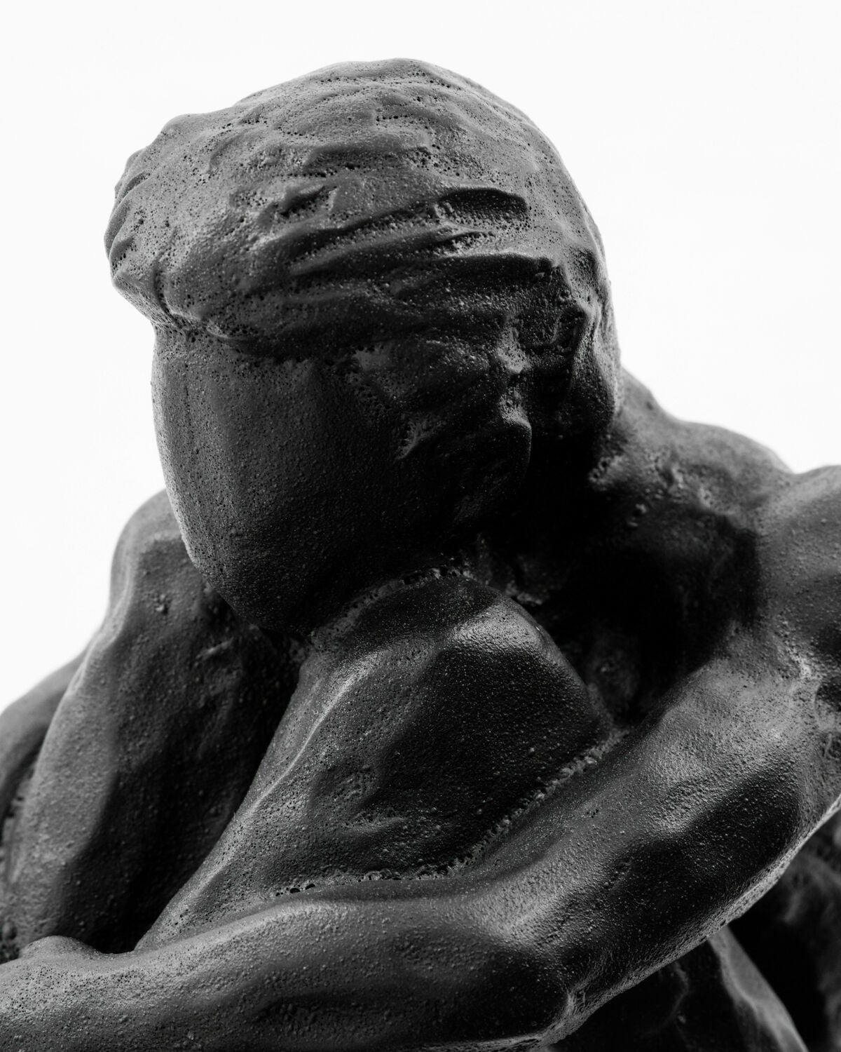 Close-up of the textured black finish on the House Doctor Forms figure sculpture