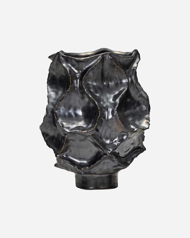 House Doctor HDWaves sculptural stoneware vase in antique metallic finish, front view.

