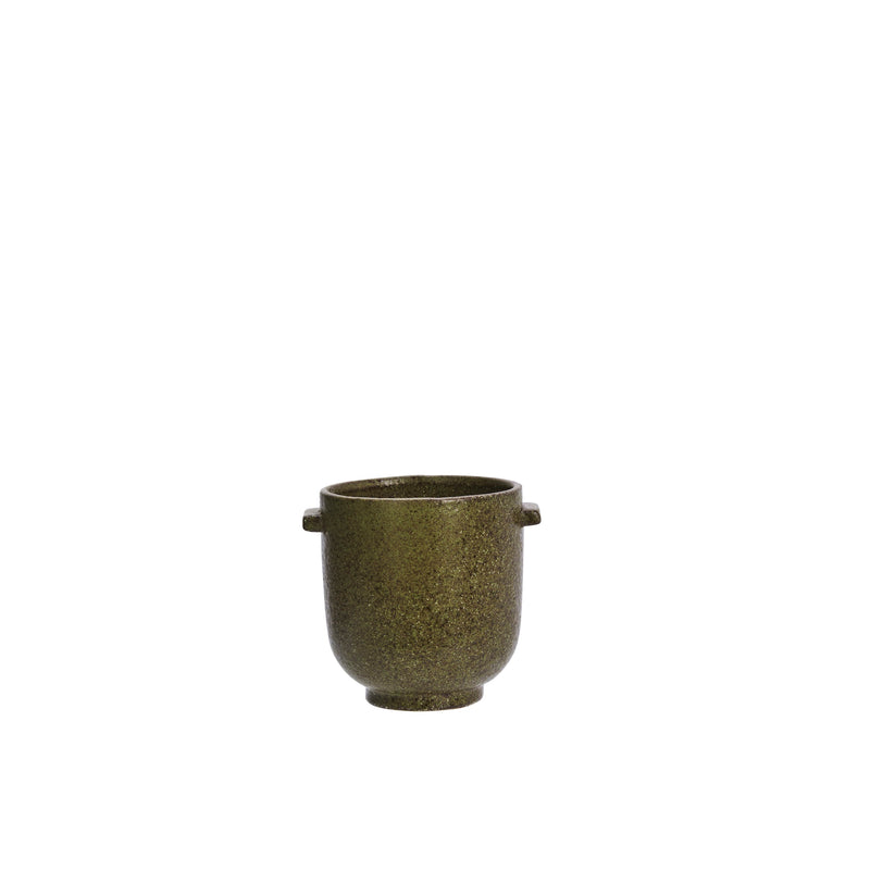 small olive stoneware pot styled with sculptural branches
