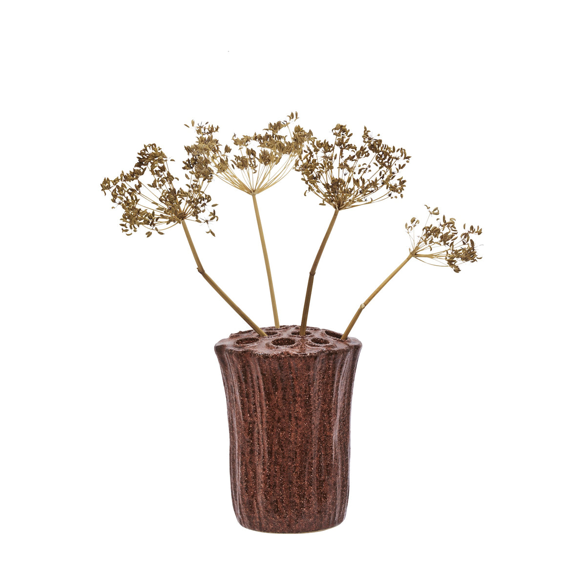 rustic stoneware vase with holes holding dried flower stems for sculptural bouquet
