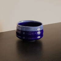 Handmade indigo matcha bowl in deep blue glaze with white crackle rim