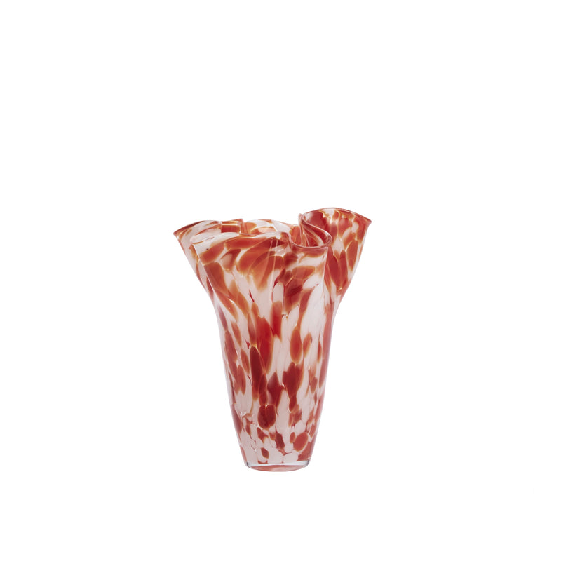 cutout of tall rust and white wavy-edge glass vase on white background
