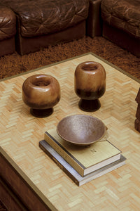 Jin stoneware bowl by Olsson & Jensen on books on a coffee table