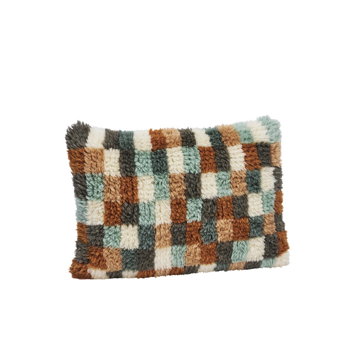 handwoven wool cushion with art deco pattern in blue, orange, and cream, rectangular shape
