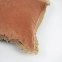 Corner detail of the rust side and jute fringe on the Julie cushion by Olsson & Jensen