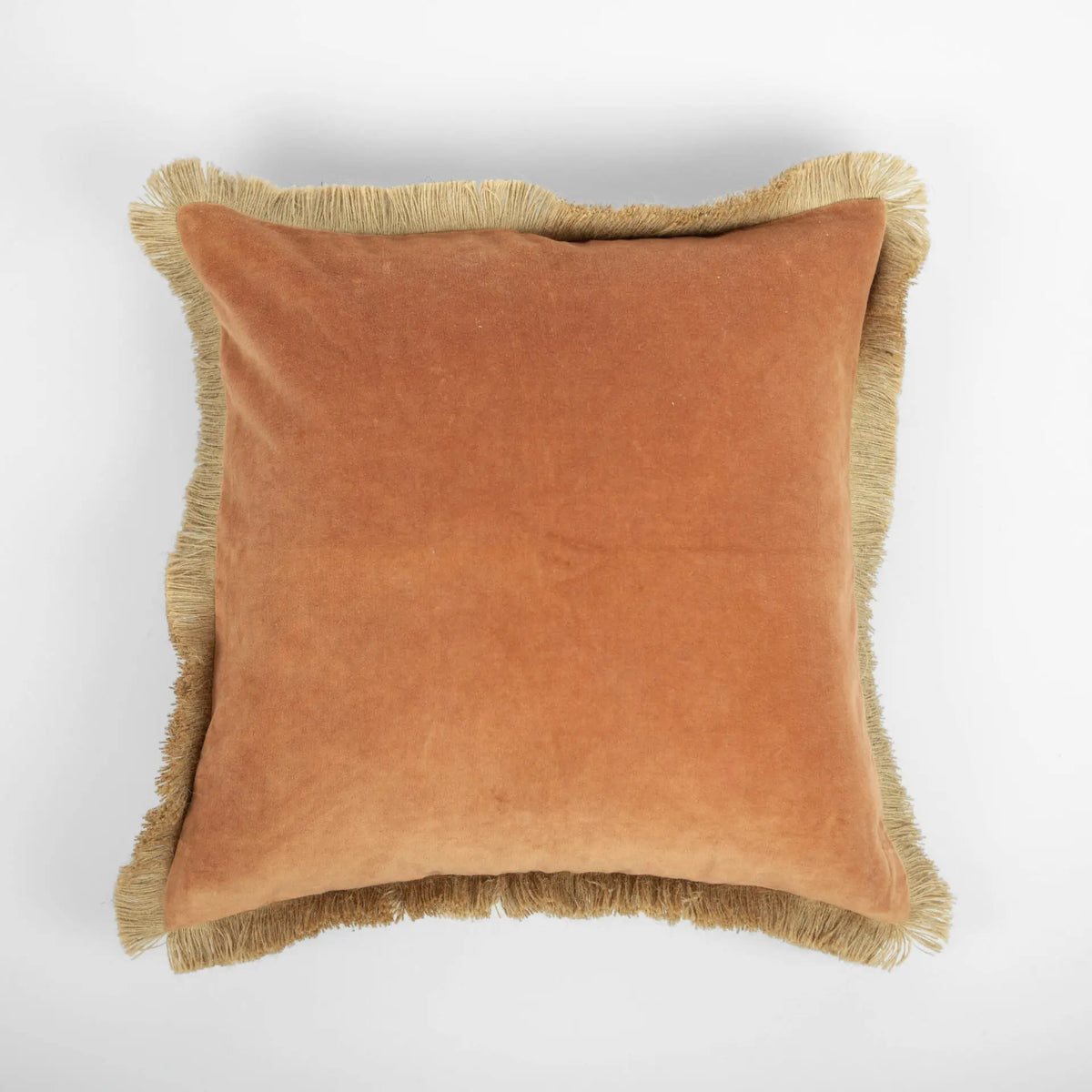 Julie cushion by Olsson & Jensen showing the rust side with jute fringe