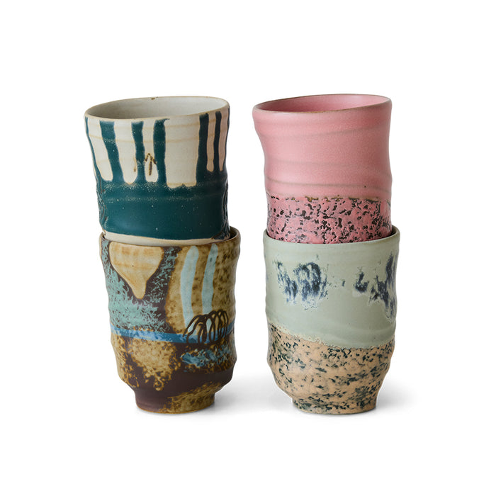 Stack of hand-finished HKLIVING mugs showing wabi-sabi glazes and tall profile.