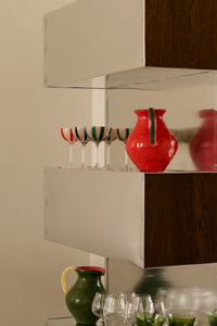 Kiko coral and green jugs by Olsson & Jensen on open shelving