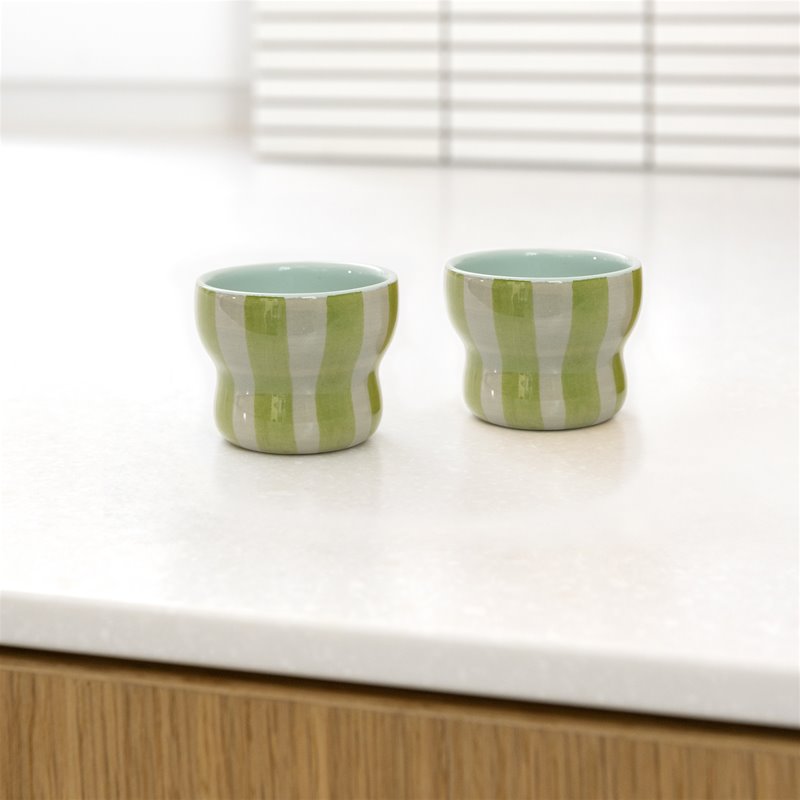 &klevering circus espresso cups small green with hand-painted stripes on kitchen counter
