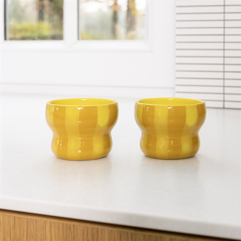 set of two &klevering circus large yellow mugs styled on a modern kitchen worktop
