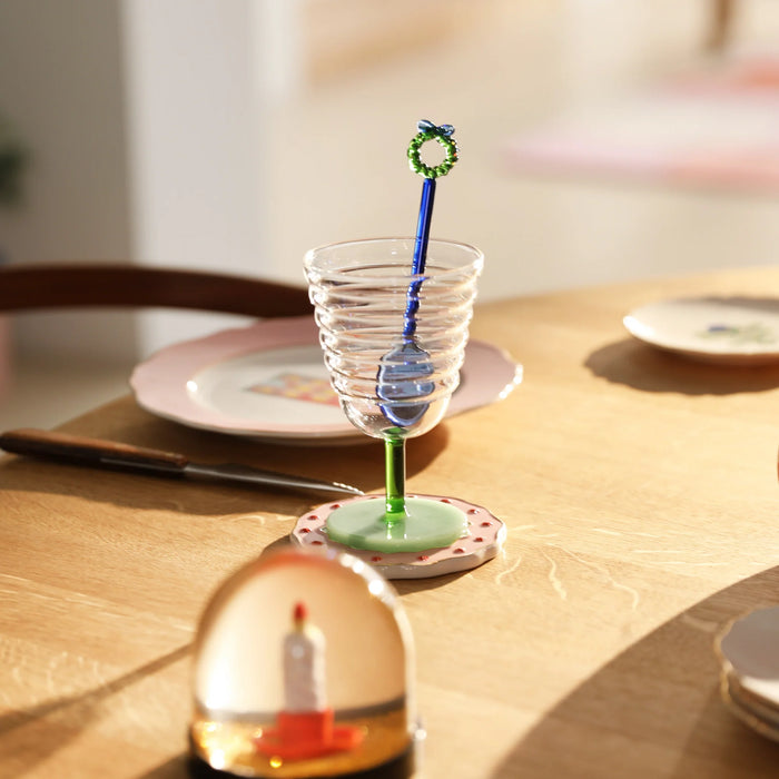 green goblet mingle glass by &klevering styled on dining table with drink