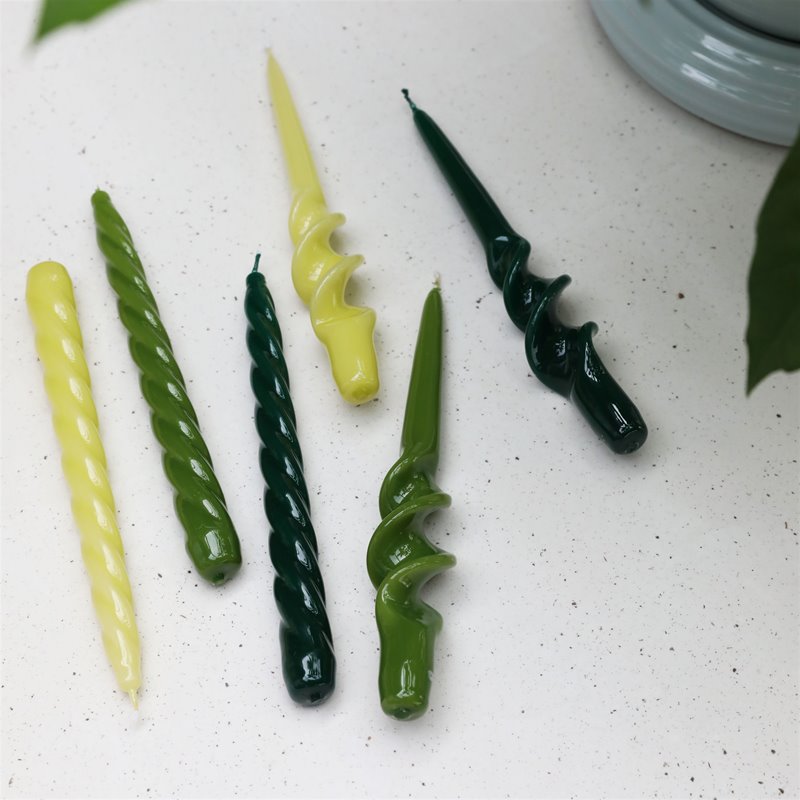 glossy green spiral and twisted tapers by &k shown in a range of tones
