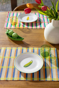 playful dining table scene with &klevering pea pod shakers and colourful placemats
