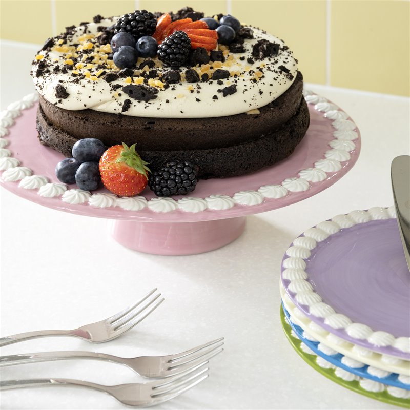 close-up of &klevering pink pedestal cake platter showing white whipped rim detail
