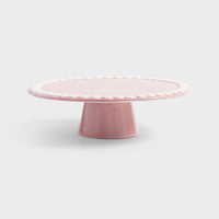 whip pink cake platter by &K pedestal design on light grey background
