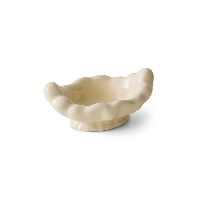 White ceramic shell-shaped bowl on a white background