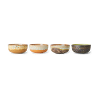 The full set of four HKLIVING Drift tapas bowls lined up on a plain white background, showing the range of natural, coastline-inspired glazes