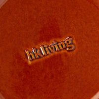 Close-up of the embossed hkliving stamp on the base of a Drift tapas bowl
