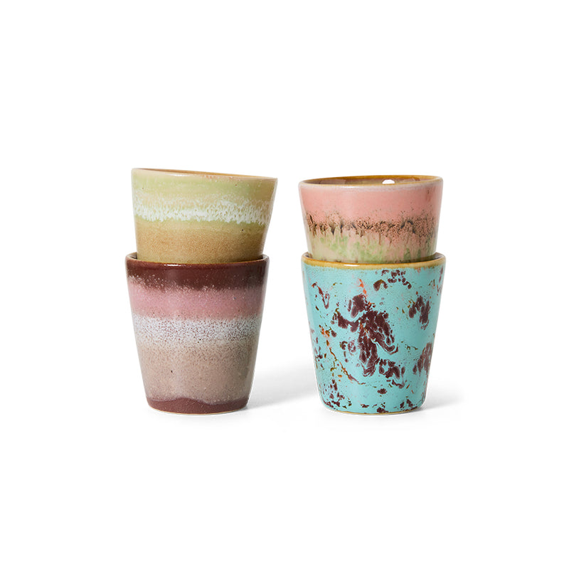Two stacked pairs of HKLIVING Futurism ristretto mugs on a plain white background, each in a different hand-painted colourway