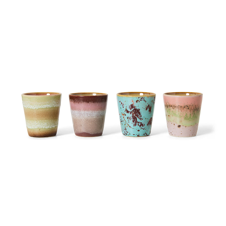 The full set of four HKLIVING Futurism ristretto mugs lined up on a plain white background, showing the range of hand-painted glazes