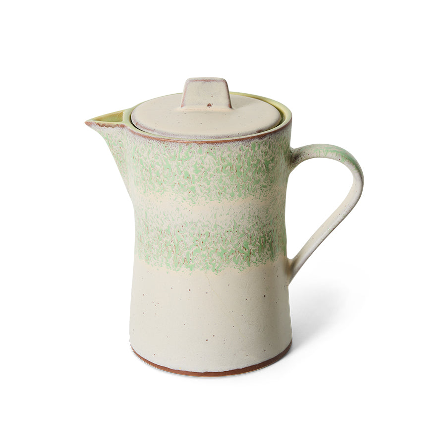 Front view of the 70s Ceramics teapot in Slush, showing the mottled sage green glaze band over a cream stoneware body