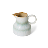 Angled view of the HKLIVING Petal milk jug, highlighting its rounded ring handle and pouring spout