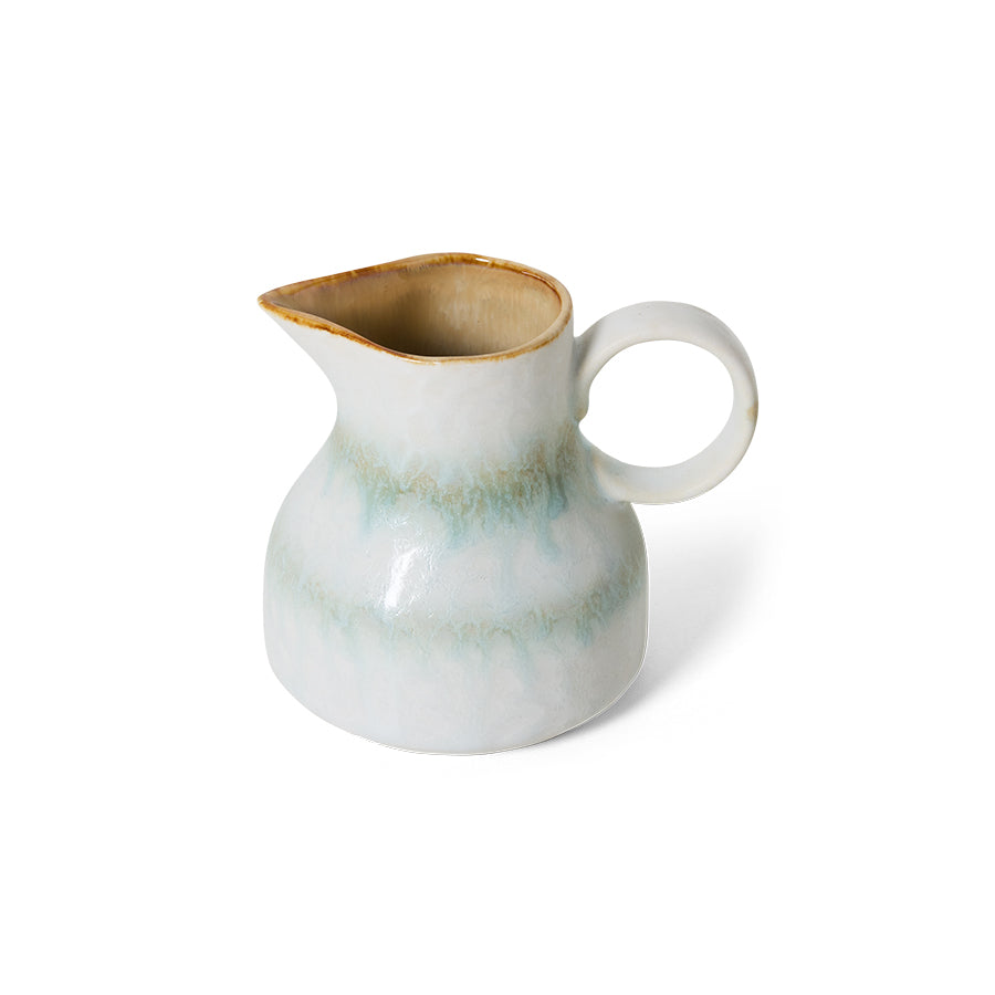 Angled view of the HKLIVING Petal milk jug, highlighting its rounded ring handle and pouring spout