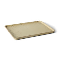 Angled view of the HKLIVING Grit large tray in yellow stoneware, showing its raised rim and speckled texture
