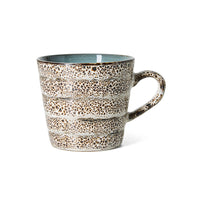 A hkliving 70s ceramic Brew coffee mug with a speckled brown and beige enamel pattern, a light blue interior, and a thick handle, shown on a white background.