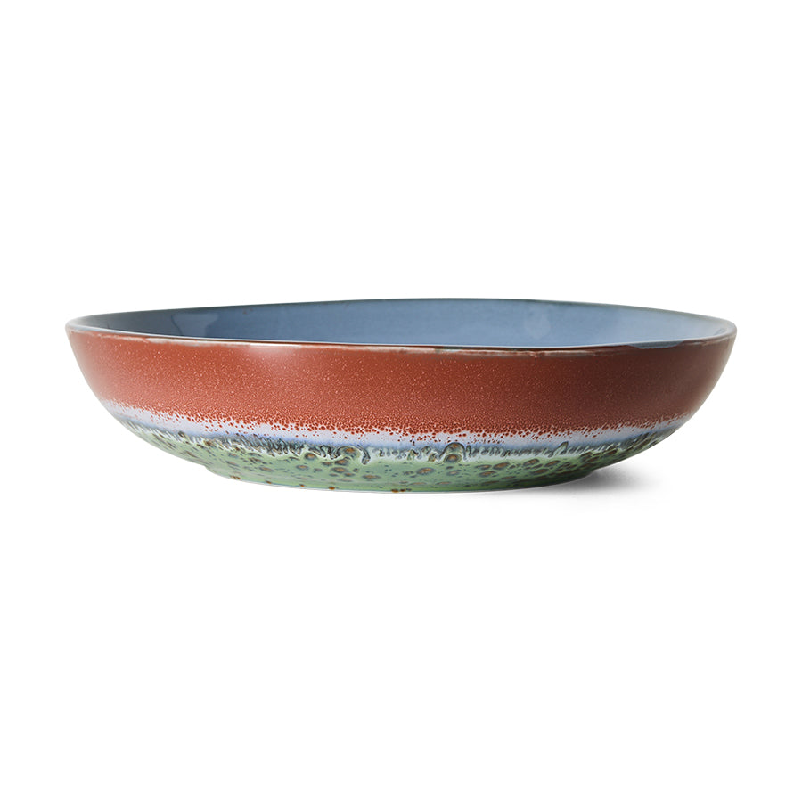 A wide 70s ceramic bowl with a textured terracotta exterior, a speckled blue interior, and a green and white mottled lower band, shown on a plain white background.