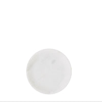 round white marble tray seen from above with natural veining
