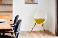 Le Feu Eye bioethanol fireplace in white with rose gold front and gold legs bringing Scandinavian elegance to a modern dining room