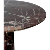 Close-up of the rounded edge and white veining on the burgundy Marel marble side table