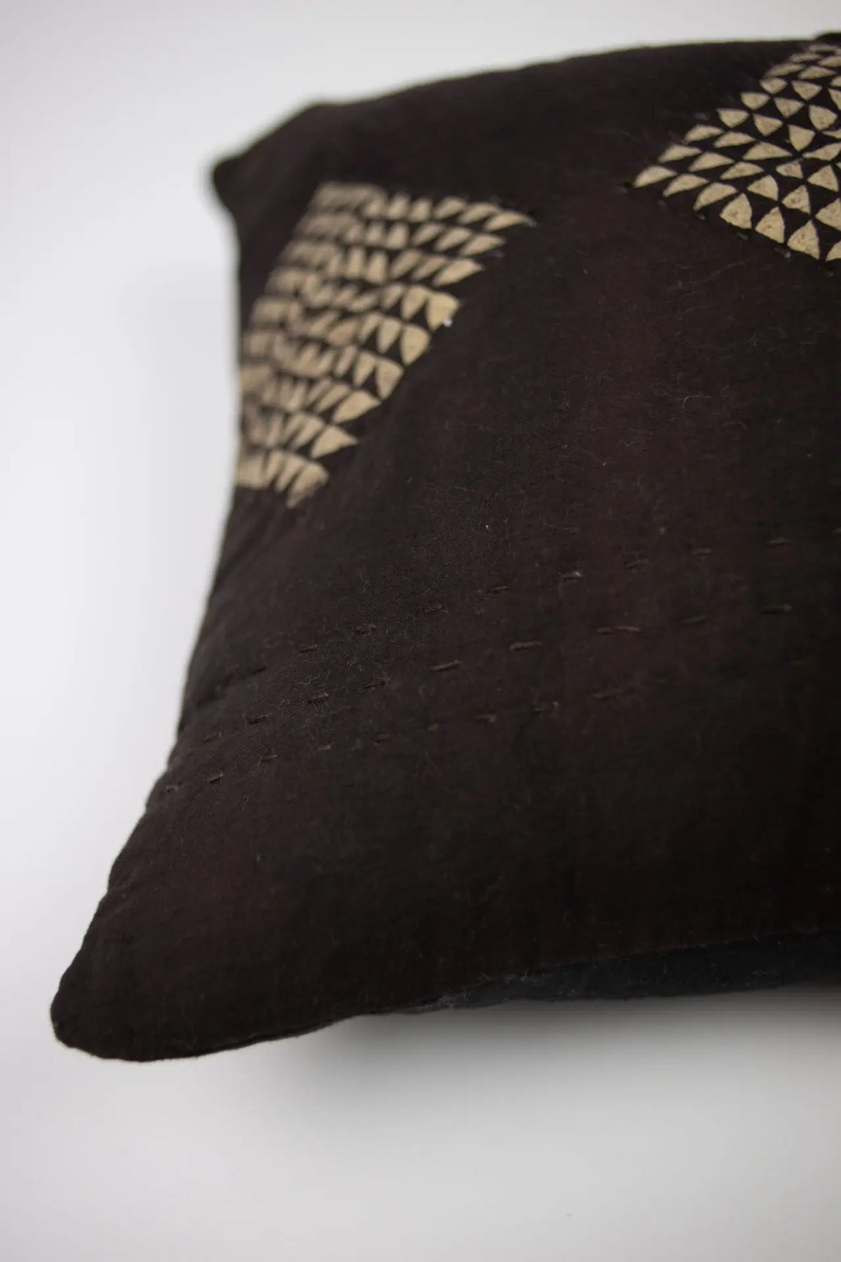 Close-up of the cream diamond pattern on the Leyla cushion by Olsson & Jensen