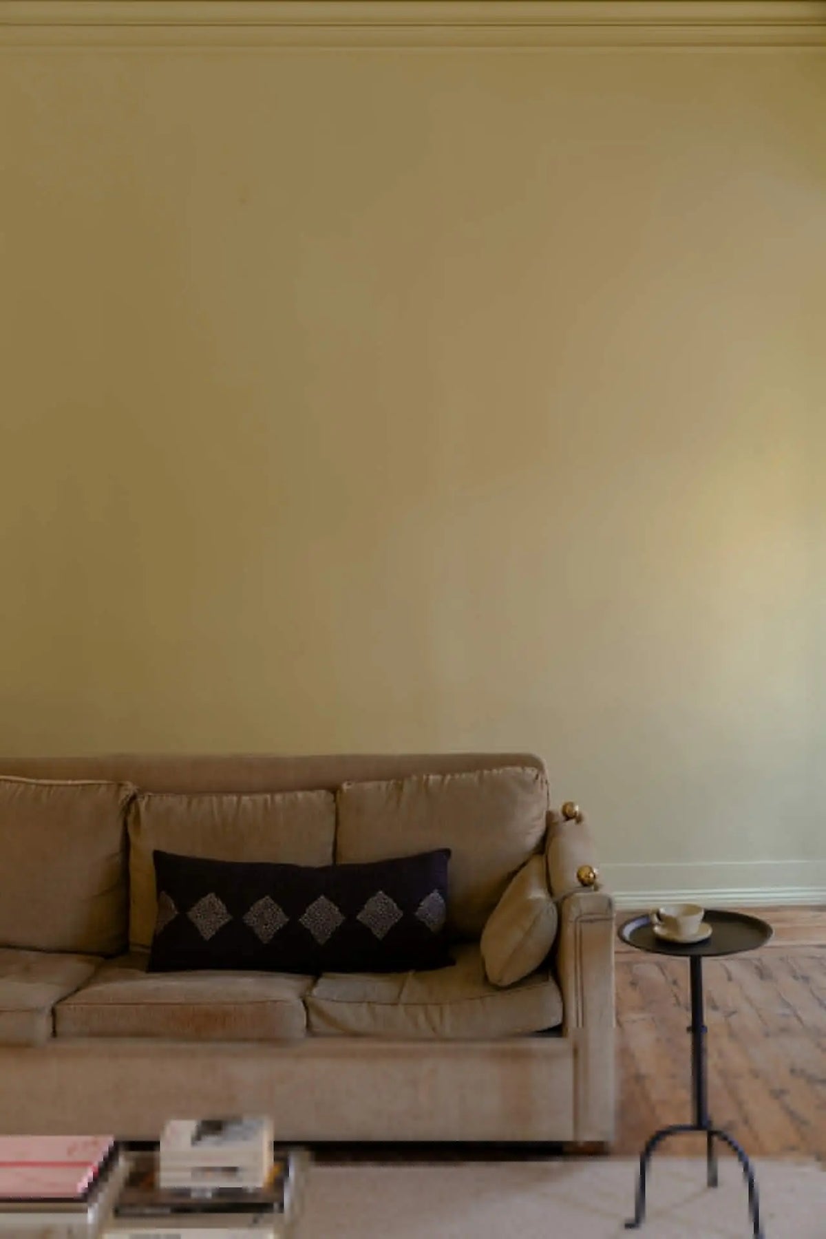 Leyla black patterned cushion by Olsson & Jensen styled on a beige sofa