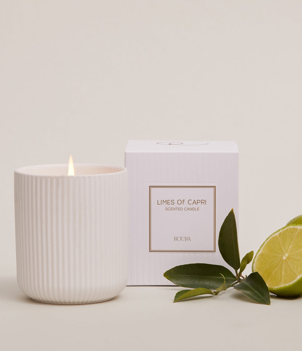 Limes of Capri citrus scented candle in white ceramic vessel with gift box and fresh limes