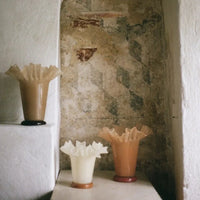 Loa ruffled glass vases by Olsson & Jensen styled in a stone alcove