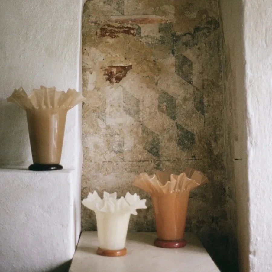Loa ruffled glass vases by Olsson & Jensen styled in a stone alcove