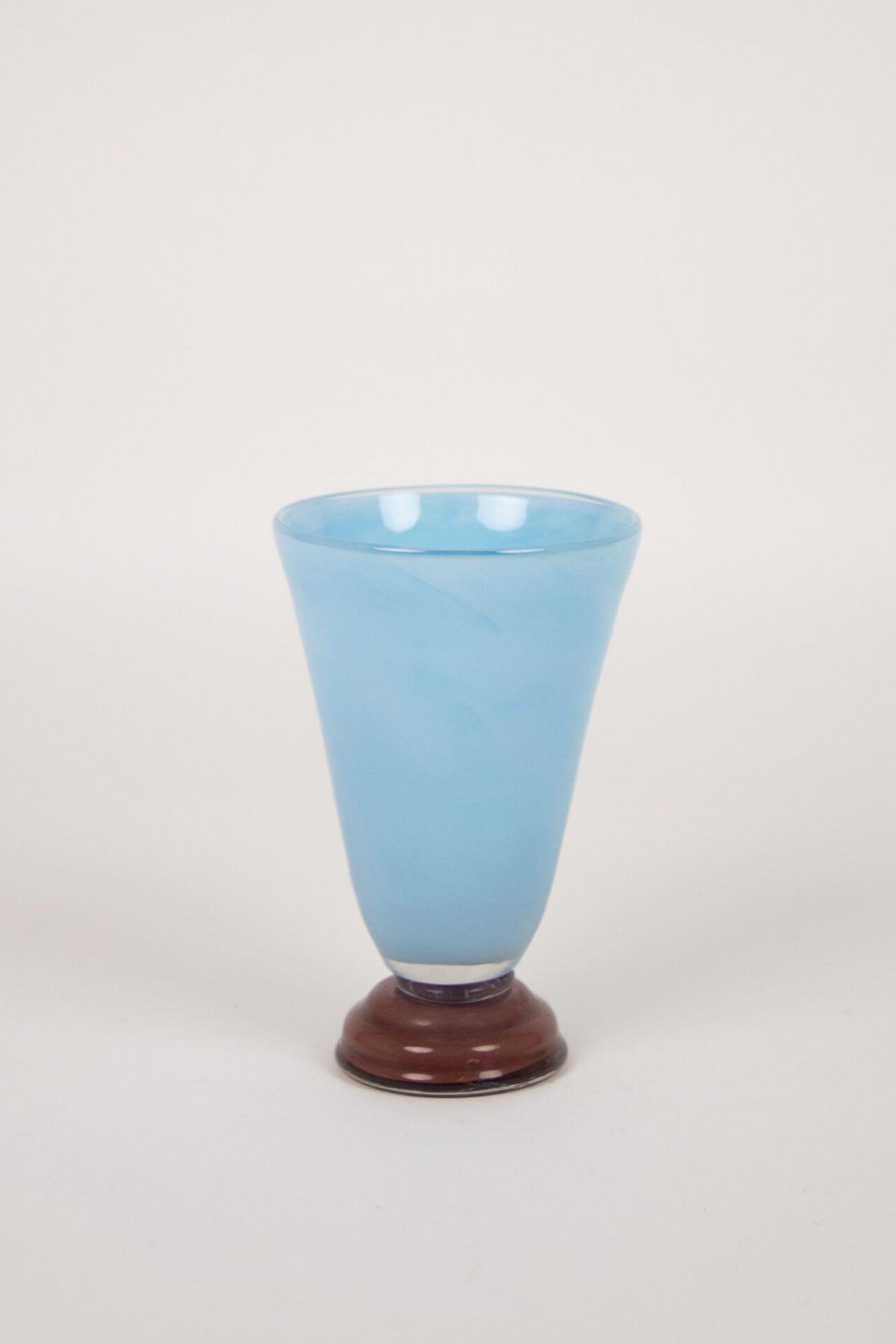 Lolli light blue glass vase with a deep red foot by Olsson & Jensen, 22 cm
