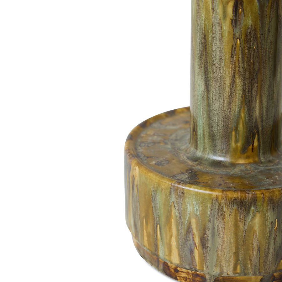 Close-up of a ceramic vase with a textured surface on a white background
